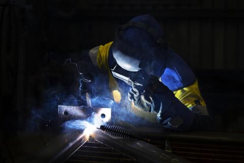 Welder with sparks flying