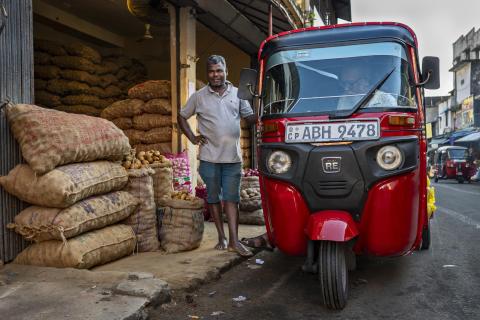A vendor sells potatoes, onions and garlic at Colombo’s Pettah Market