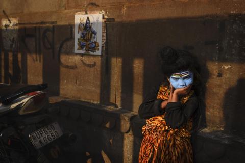 Children in Varanasi dress as Lord Shiva primarily to attract donations from tourists and pilgrims