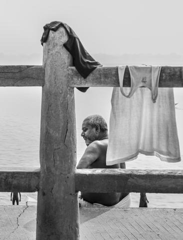 Along the banks of the sacred Ganges, Hindus gather to pray, bathe, and wash their clothes