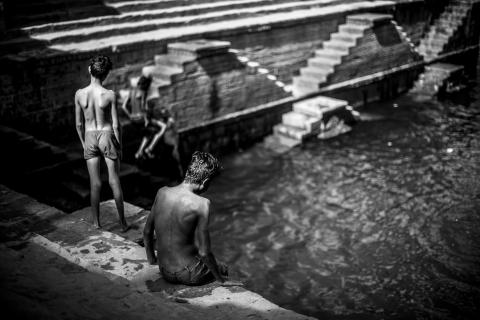 Two boys bathing in India