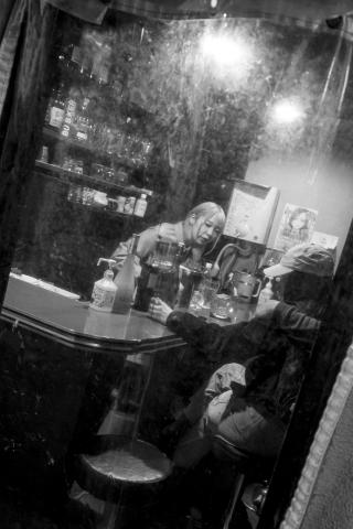 Looking at a bar through a window