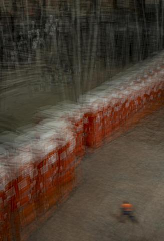 Portaloos in a line with a movement blur