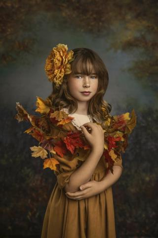 A girl wrapped in a flower shawl. 