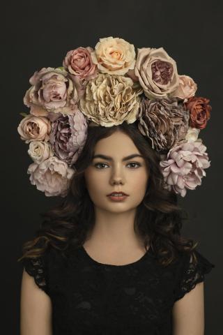 A girl in a large flower crown