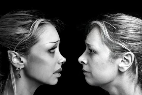 two women, side profiles, facing each other